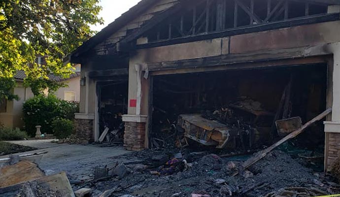 A severely burnt garage with extensive fire damage
