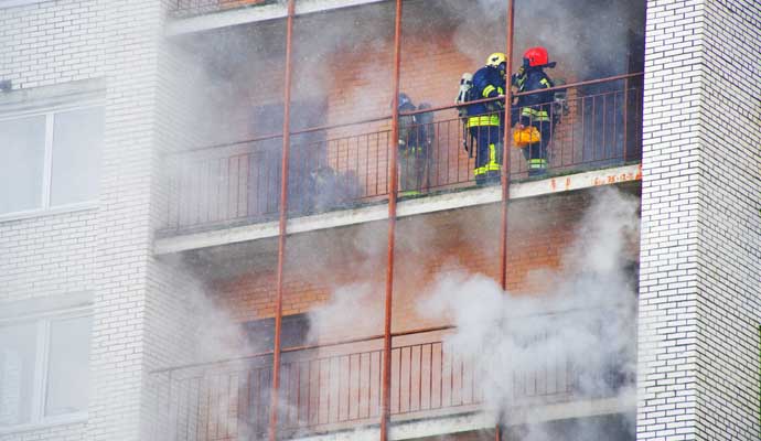 Professional worker restoring hotel from fire