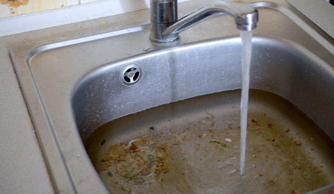 overflowing kitchen sink