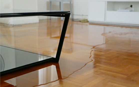 water damaged floor in a living room