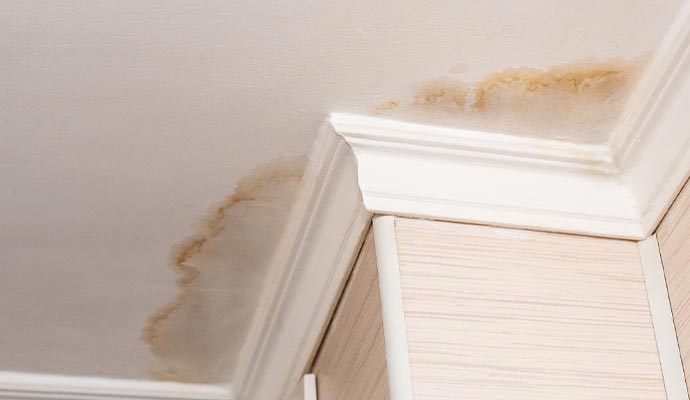 ceiling with visible water damage due to water leaking